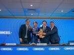 Paraguay's Soccer Association President Robert Harrison, Uruguay's Soccer Association President Ignacio Alonso, Conmebol President Alejandro Dominguez, and Conmebol Vice President Claudio Tapia poses for a photo with the World Cup trophy FIFA, in Luque, Paraguay