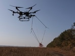 A drone with a metal detector for mine searching is seen during demining a field, amid Russia's attack on Ukraine.