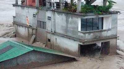 The flash flood in the Teesta River, triggered by the cloudburst in Lhonak Lake in North Sikkim, caused an accumulation of a huge quantity of water, which turned towards Chungthang dam destroying the power infrastructure before moving downstream in spate, flooding towns and villages. (AFP) The flash flood in the Teesta River, triggered by the cloudburst in Lhonak Lake in North Sikkim, caused an accumulation of a huge quantity of water, which turned towards Chungthang dam destroying the power infrastructure before moving downstream in spate, flooding towns and villages. (AFP)
