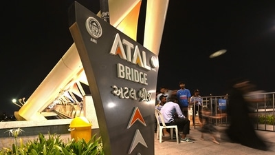 People visit the Atal Pedestrian Bridge at the Sabarmati riverfront in Ahmedabad. (AFP) People visit the Atal Pedestrian Bridge at the Sabarmati riverfront in Ahmedabad. (AFP)