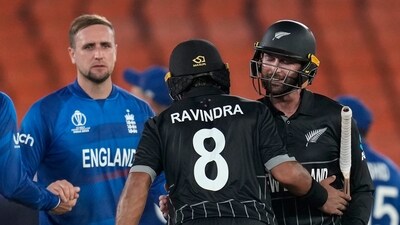 England's Liam Livingstone holds hand with teammate Dawid Malan and watches New Zealand's Rachin Ravindra and Devon Conway celebrate at the end of the ICC Cricket World Cup opening match against New Zealand in Ahmedabad, India (AP) England's Liam Livingstone holds hand with teammate Dawid Malan and watches New Zealand's Rachin Ravindra and Devon Conway celebrate at the end of the ICC Cricket World Cup opening match against New Zealand in Ahmedabad, India (AP)