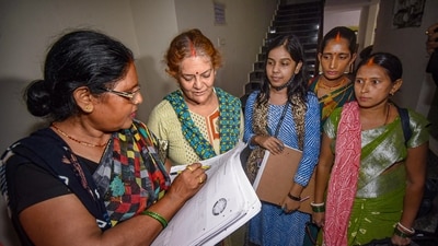 Patna: Enumerator staff collect information from residents for a caste-based census in Bihar after Patna High Court rejected a petition against the survey, in Patna. (PTI) Patna: Enumerator staff collect information from residents for a caste-based census in Bihar after Patna High Court rejected a petition against the survey, in Patna. (PTI)