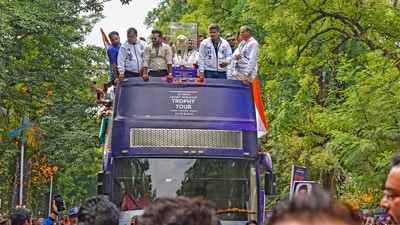 Indian cricketers Kedar Jadhav and Rohit Pawar, President of MCA, and others during the ICC men's World Cup trophy tour in Pune (PTI) Indian cricketers Kedar Jadhav and Rohit Pawar, President of MCA, and others during the ICC men's World Cup trophy tour in Pune (PTI)