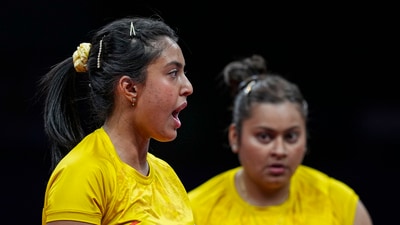 Sutirtha Mukherjee (R) and Ayhika Mukherjee during women's doubles semifinal match of table tennis against Korean pair of Suyong Cha and Sugyong Pak at the 19th Asian Games (PTI) Sutirtha Mukherjee (R) and Ayhika Mukherjee during women's doubles semifinal match of table tennis against Korean pair of Suyong Cha and Sugyong Pak at the 19th Asian Games (PTI)