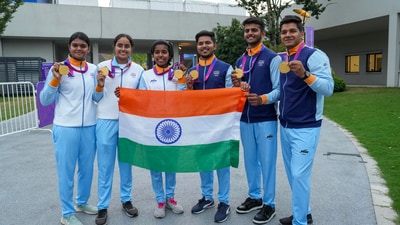 Gold medalist Indian women archers Jyothi Surekha Vennam, Parneet Kaur and Aditi Gopichand Swami pose for photos with gold medalist compatriot men archers Ojas Pravin Deotale, Prathamesh Samadhan Jawkar and Abhishek Verma after the Compound Team Archery events at the 19th Asian Games (PTI) Gold medalist Indian women archers Jyothi Surekha Vennam, Parneet Kaur and Aditi Gopichand Swami pose for photos with gold medalist compatriot men archers Ojas Pravin Deotale, Prathamesh Samadhan Jawkar and Abhishek Verma after the Compound Team Archery events at the 19th Asian Games (PTI)