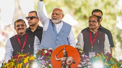 PM Modi with Madhya Pradesh CM Shivraj Singh Chouhan waves at the crowd during his visit for the 'Bhoomi Pujan' of several development works, in Jabalpur. (PTI) PM Modi with Madhya Pradesh CM Shivraj Singh Chouhan waves at the crowd during his visit for the 'Bhoomi Pujan' of several development works, in Jabalpur. (PTI)