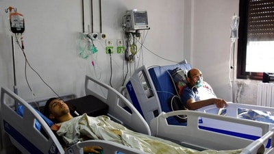 Injured individuals from the drone attack targeting a Syrian military academy receiving medical treatment at a hospital in government-controlled Homs. (AFP) Injured individuals from the drone attack targeting a Syrian military academy receiving medical treatment at a hospital in government-controlled Homs. (AFP)