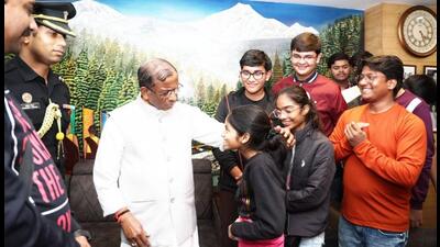 Sikkim governor Laxman Acharya with schoolchildren of Varanasi after they were brought out safely from the flood area in Gangtok. (Sourced)