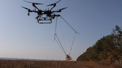 A drone with a metal detector for mine searching is seen during demining a field, amid Russia's attack on Ukraine. (REUTERS)
