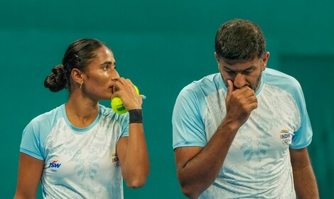 India's Rohan Bopanna and Rutuja Sampatrao Bhosale during the Mixed Doubles Final tennis match (PTI) India's Rohan Bopanna and Rutuja Sampatrao Bhosale during the Mixed Doubles Final tennis match (PTI)