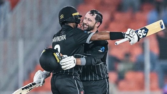 New Zealand's Devon Conway (R) celebrates with Rachin Ravindra after scoring a century (100 runs) during the 2023 ICC men's cricket World Cup (AFP)
