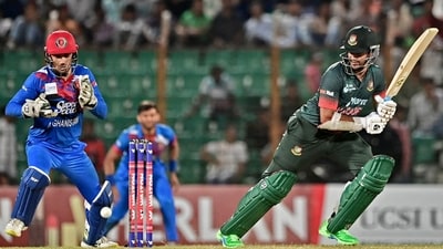 Shakib Al Hasan (R) plays a shot as Afghanistan's wicketkeeper Rahmanullah Gurbaz (L) looks on (AFP) Shakib Al Hasan (R) plays a shot as Afghanistan's wicketkeeper Rahmanullah Gurbaz (L) looks on (AFP)
