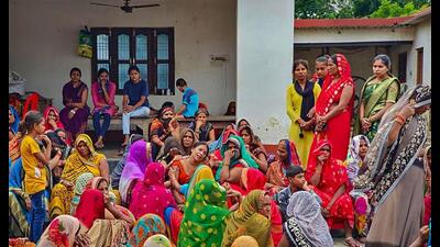 Family members mourn after six people, including five of a family, were killed over a property dispute, in Deoria recently. (PTI Photo) Family members mourn after six people, including five of a family, were killed over a property dispute, in Deoria recently. (PTI Photo)