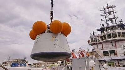 Joint team of Indian Navy and Isro during the recovery trials of Mission Gaganyaan's Crew Module onboard earmarked ship, at Eastern Naval Command, in Visakhapatnam (PTI) Joint team of Indian Navy and Isro during the recovery trials of Mission Gaganyaan's Crew Module onboard earmarked ship, at Eastern Naval Command, in Visakhapatnam (PTI)