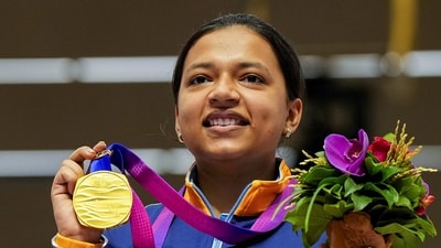 Indian shooter Sift Kaur Samra poses for photos with her gold medal during the presentation ceremony of the women's 50m rifle 3 positions event (PTI) Indian shooter Sift Kaur Samra poses for photos with her gold medal during the presentation ceremony of the women's 50m rifle 3 positions event (PTI)