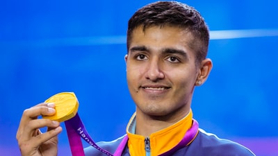 India squash player Abhay Singh poses for photos during the presentation ceremony of the men's team event at the 19th Asian Games (PTI) India squash player Abhay Singh poses for photos during the presentation ceremony of the men's team event at the 19th Asian Games (PTI)