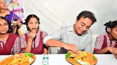 State minister for information technology and industries K T Rama Rao shares breakfast with school students (Twitter/@MinisterKTR)