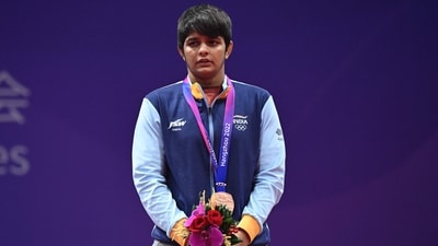Sonam stands on the podium during the award ceremony of the women's 62kg freestyle wrestling event during the Asian Games in Hangzhou (AFP) Sonam stands on the podium during the award ceremony of the women's 62kg freestyle wrestling event during the Asian Games in Hangzhou (AFP)