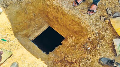 When police visited the spot, they found a pile of fodder and when it was removed, it could be seen that a portion had been dug out in square shape. (HT Photo) When police visited the spot, they found a pile of fodder and when it was removed, it could be seen that a portion had been dug out in square shape. (HT Photo)