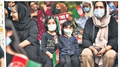 Yosuf Noor was one of the 180 students at the the Sayed Jamaluddin Afghan school in Bhogal; (right) A protest against the Taliban. Yosuf Noor was one of the 180 students at the the Sayed Jamaluddin Afghan school in Bhogal; (right) A protest against the Taliban.