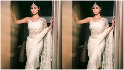 Mouni further accessorised her look for the day in an oxidised golden maang tikka with pastel green embellishments from the house of Golecha’s Jewels. (Instagram/@imouniroy) Mouni further accessorised her look for the day in an oxidised golden maang tikka with pastel green embellishments from the house of Golecha’s Jewels. (Instagram/@imouniroy)