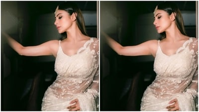 Mouni looked every bit gorgeous in the white saree with netted details and embroidery work in white threads throughout. Mouni teamed it with a matching white sleeveless blouse. (Instagram/@imouniroy) Mouni looked every bit gorgeous in the white saree with netted details and embroidery work in white threads throughout. Mouni teamed it with a matching white sleeveless blouse. (Instagram/@imouniroy)