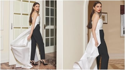Her strapless jumpsuit features a two-tone palette with a white satin top, black trousers and an artfully draped back with a sweeping floor. (Instagram/@aditiraohydari) Her strapless jumpsuit features a two-tone palette with a white satin top, black trousers and an artfully draped back with a sweeping floor. (Instagram/@aditiraohydari)