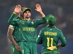 South Africa's Keshav Maharaj (C) celebrates with his team captain Temba Bavuma after their victory South Africa's Keshav Maharaj (C) celebrates with his team captain Temba Bavuma after their victory