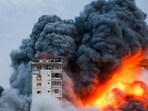 Israel-Palestine Latest: Smoke and flames billow after Israeli forces struck a high-rise tower in Gaza City.