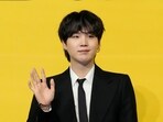 FILE - Suga, a member of South Korean K-pop band BTS, poses for photographers ahead of a press conference to introduce their new single "Butter" in Seoul, South Korea on May 21, 2021. (AP Photo/Lee Jin-man, File)
