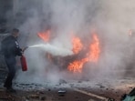 Israel-Palestine Latest: A member of Israeli security forces tries to extinguish fire on cars following a rocket attack from the Gaza Strip in Ashkelon, southern Israel. Israel-Palestine Latest: A member of Israeli security forces tries to extinguish fire on cars following a rocket attack from the Gaza Strip in Ashkelon, southern Israel.