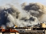 Smoke plumes rise over Gaza City during Israeli air strikes. Smoke plumes rise over Gaza City during Israeli air strikes.
