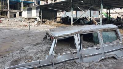 A car buried under the silt with just it roofs showing in flood hit north Sikkim (HT Photo) A car buried under the silt with just it roofs showing in flood hit north Sikkim (HT Photo)