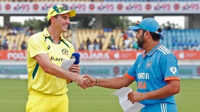 Captains Rohit Sharma and Pat Cummins greet each other at the toss during the 3rd and final ODI between Australia and India, at Saurashtra Cricket Association Stadium in Rajkot (ANI) Captains Rohit Sharma and Pat Cummins greet each other at the toss during the 3rd and final ODI between Australia and India, at Saurashtra Cricket Association Stadium in Rajkot (ANI)