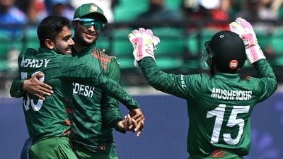 Mehidy Hasan Miraz celebrates with teammates after taking the wicket of Rashid Khan during the 2023 ICC Men's Cricket World Cup (AFP) Mehidy Hasan Miraz celebrates with teammates after taking the wicket of Rashid Khan during the 2023 ICC Men's Cricket World Cup (AFP)