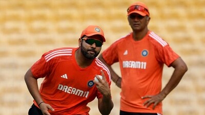 India's Rohit Sharma during practice as head coach Rahul Dravid looks on (REUTERS)