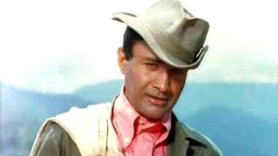 Filmstar Devanand spelt charm in his hat and coat. (HT File) Filmstar Devanand spelt charm in his hat and coat. (HT File)