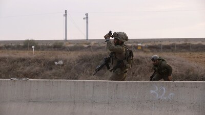 Israeli soldiers during combat operations against Palestinian militants on a road near Sderot, Israel, (Bloomberg)