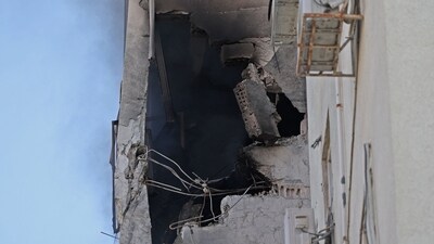A residential building in Tel Aviv is damaged following a rocket attack from the Gaza Strip into Israel. (AFP) A residential building in Tel Aviv is damaged following a rocket attack from the Gaza Strip into Israel. (AFP)