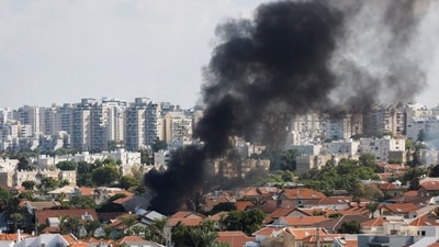 Smoke rises in the aftermath of rocket barrages that were launched from Gaza, in Ashkelon, Israel. (Reuters)