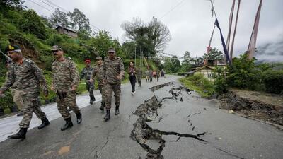 Indian Army officers inspect the damage caused by flash floods triggered by heavy rainfall in Naga village of north Sikkim (PTI) Indian Army officers inspect the damage caused by flash floods triggered by heavy rainfall in Naga village of north Sikkim (PTI)