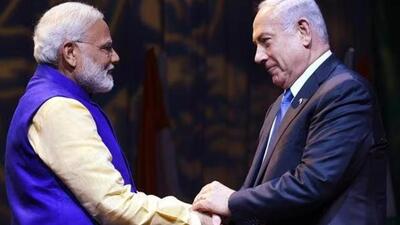 Prime Minister Narendra Modi shakes hands with Israeli Prime Minister Benjamin Netanyahu at the Community Reception Programme in Tel Aviv (PTI Photo) Prime Minister Narendra Modi shakes hands with Israeli Prime Minister Benjamin Netanyahu at the Community Reception Programme in Tel Aviv (PTI Photo)