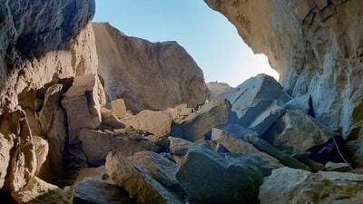 The mouth of the natural tunnel at Chaura on the Hindustan-Tibet Road or National Highway number 5 blocked by boulders after the landslide in Kinnaur district on Saturday. (HT Photo) The mouth of the natural tunnel at Chaura on the Hindustan-Tibet Road or National Highway number 5 blocked by boulders after the landslide in Kinnaur district on Saturday. (HT Photo)