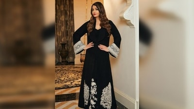 In Aishwarya Rai Bachchan's ensemble, delicate white embroidery graces both the jacket and the dress, enhancing its overall elegance. (Instagram/@manishmalhotra05) In Aishwarya Rai Bachchan's ensemble, delicate white embroidery graces both the jacket and the dress, enhancing its overall elegance. (Instagram/@manishmalhotra05)