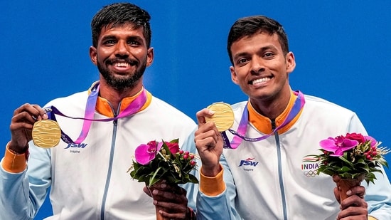 Chirag Shetty and Satwiksairaj Rankireddy pose for photos during the presentation ceremony after winning the men's doubles gold (PTI)
