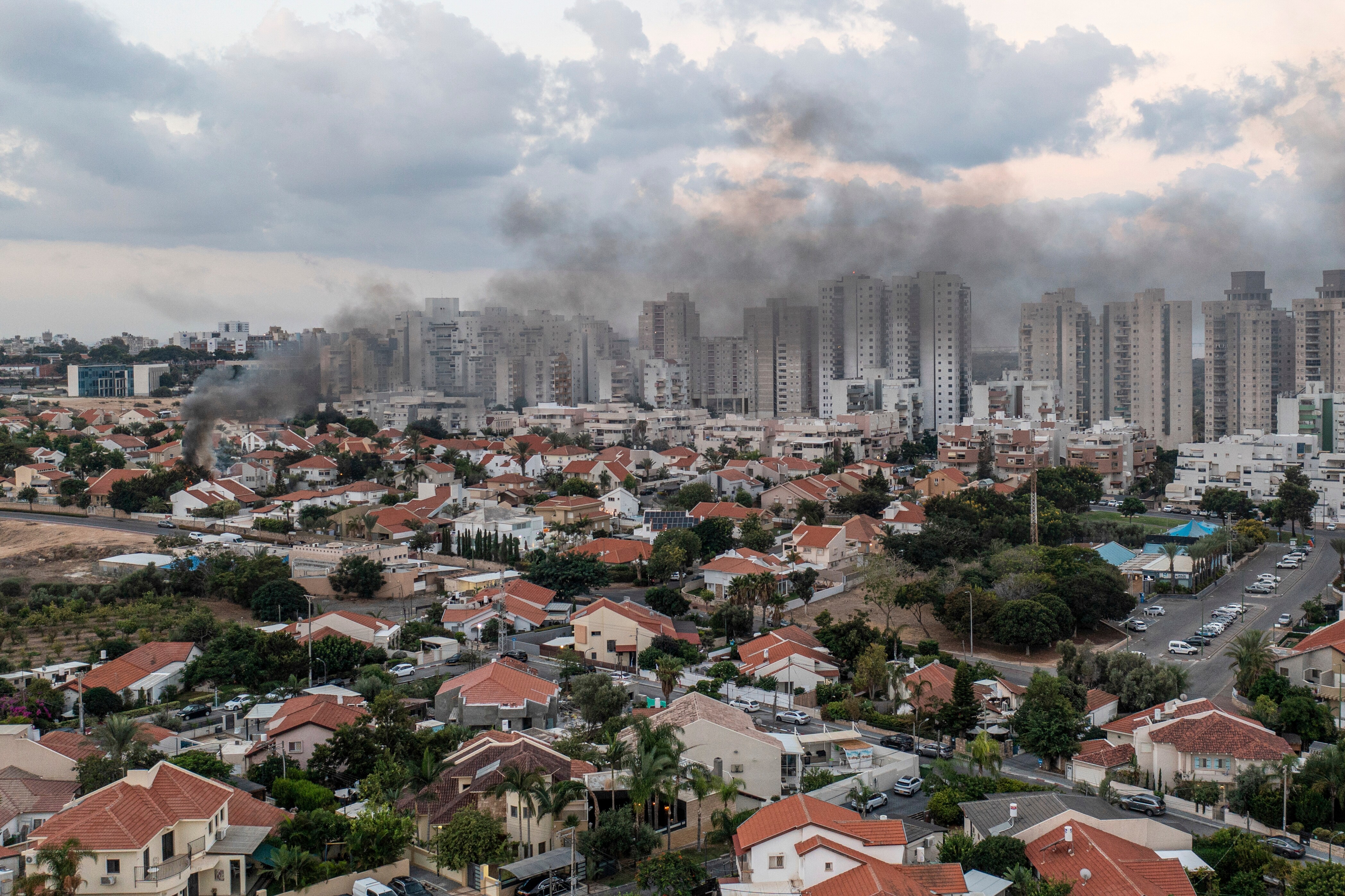 Smoke rises after a rocket fired from the Gaza Strip hit a house in Ashkelon, southern Israel, Saturday, Oct. 7, 2023. The rockets were fired as Hamas announced a new operation against Israel. (AP Photo/Tsafrir Abayov) (AP) Smoke rises after a rocket fired from the Gaza Strip hit a house in Ashkelon, southern Israel, Saturday, Oct. 7, 2023. The rockets were fired as Hamas announced a new operation against Israel. (AP Photo/Tsafrir Abayov) (AP)