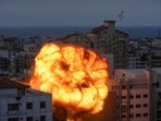 Israel-Palestine Conflict: Fire and smoke rise following an Israeli airstrike, in Gaza City.