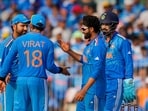 India's Ravindra Jadeja celebrates with teammates the wicket of Australia's batter Alex Carey during the ICC Men's Cricket World Cup match between India and Australia