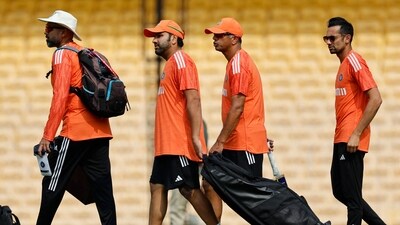 India head coach Rahul Dravid and captain Rohit Sharma arrive before practice (REUTERS)