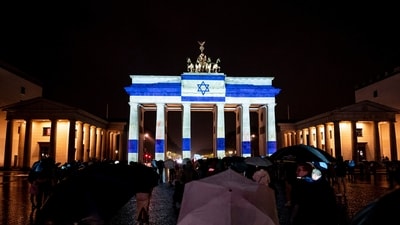 The Brandenburg Gate is illuminated in the colors of the Israeli flag as a show of solidarity in Berlin on October 7. (AP) The Brandenburg Gate is illuminated in the colors of the Israeli flag as a show of solidarity in Berlin on October 7. (AP)